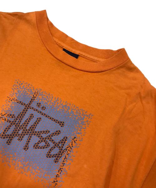stussy（ステューシー）stussy (ステューシー) ロゴプリントTシャツ オレンジ サイズ:Mの古着・服飾アイテム