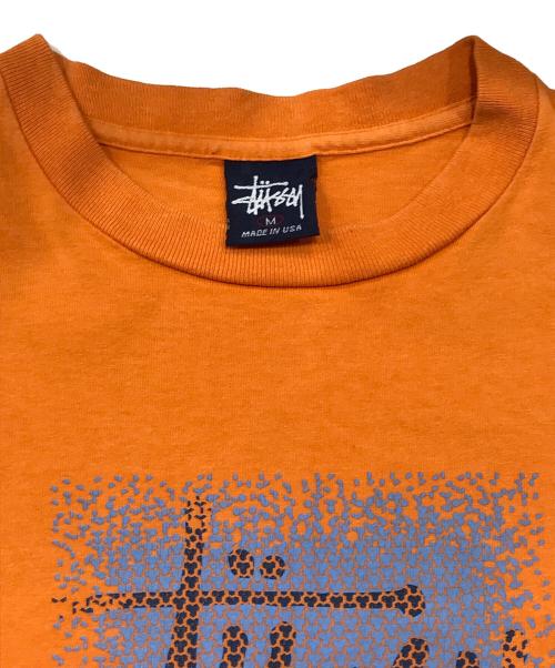 stussy（ステューシー）stussy (ステューシー) ロゴプリントTシャツ オレンジ サイズ:Mの古着・服飾アイテム