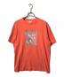 Supreme（シュプリーム）の古着「サイン・オブ・ザ・タイムズTシャツ」｜オレンジ