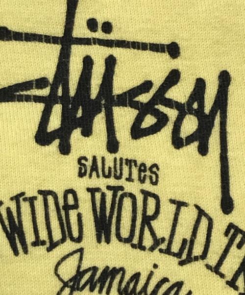 stussy（ステューシー）stussy (ステューシー) ワールドツアープリントTシャツ イエロー サイズ:Mの古着・服飾アイテム