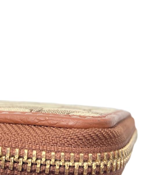 COACH（コーチ）COACH (コーチ) Disney (ディズニー) 長財布 ブラウンの古着・服飾アイテム