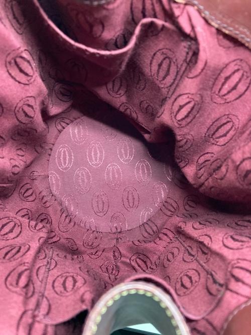 must de cartier（マストドゥカルティエ）must de cartier (マストドゥカルティエ) バッグ ボルドーの古着・服飾アイテム