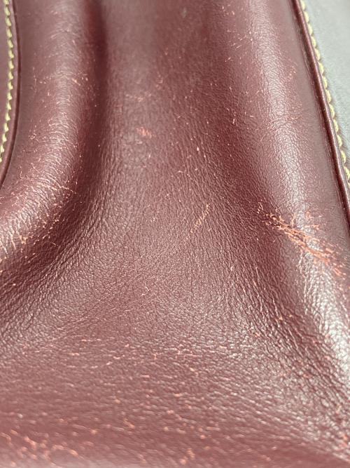 must de cartier（マストドゥカルティエ）must de cartier (マストドゥカルティエ) バッグ ボルドーの古着・服飾アイテム