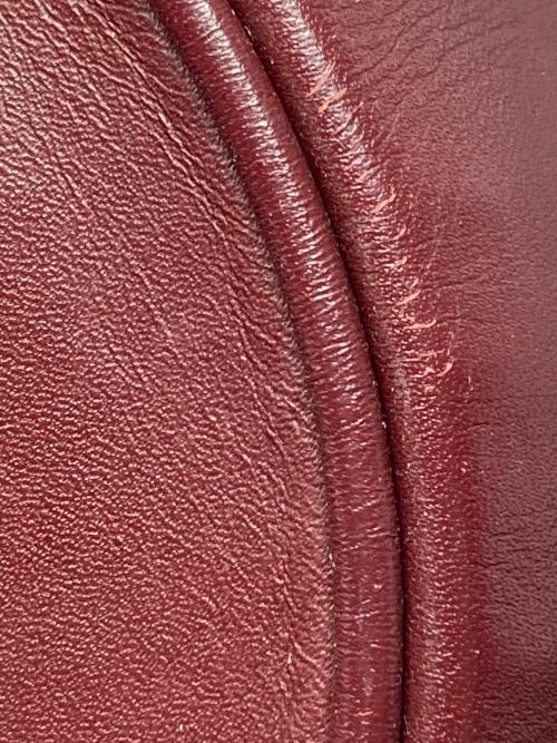 must de cartier（マストドゥカルティエ）must de cartier (マストドゥカルティエ) バッグ ボルドーの古着・服飾アイテム