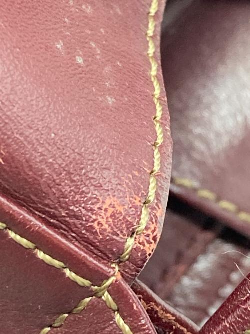 must de cartier（マストドゥカルティエ）must de cartier (マストドゥカルティエ) バッグ ボルドーの古着・服飾アイテム