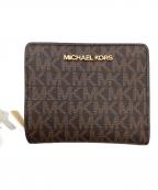 MICHAEL KORSマイケル・コース）の古着「2つ折り財布」｜ブラウン