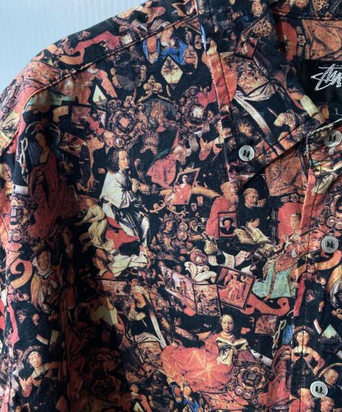 stussy（ステューシー）stussy (ステューシー) 宗教柄シャツ ブラック×オレンジ サイズ:Lの古着・服飾アイテム