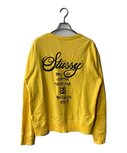 stussy（ステューシー）stussy (ステューシー) World Tour Crew ロゴスウェット イエロー サイズ:XLの古着・服飾アイテム
