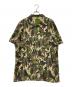 X-LARGE（エクストララージ）の古着「ディズニーコラボ カモ柄半袖シャツ」｜グリーン