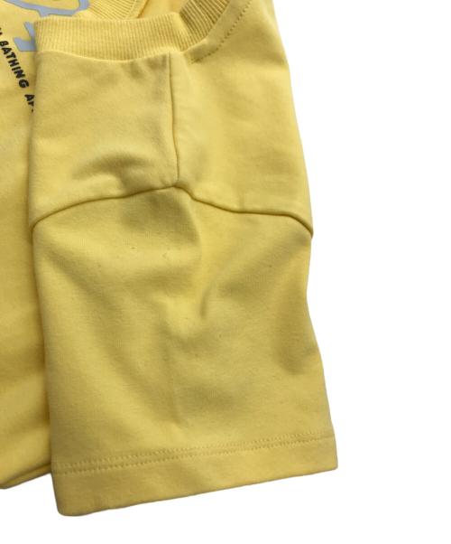 APEE by A BATHING APE（エーエイプ・バイ・ア・ベイシング・エイプ）APEE By A BATHING APE (エーエイプ・バイ・ア・ベイシング・エイプ) DRAPED STRAP GRAPHIC TOP イエロー サイズ:XSの古着・服飾アイテム