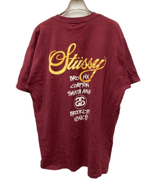 stussy（ステューシー）stussy (ステューシー) ワールドツアープリントTシャツ レッド サイズ:Lの古着・服飾アイテム