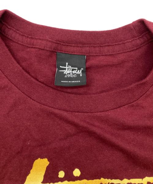 stussy（ステューシー）stussy (ステューシー) ワールドツアープリントTシャツ レッド サイズ:Lの古着・服飾アイテム