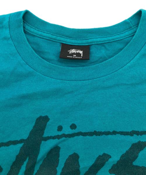 stussy（ステューシー）stussy (ステューシー) ワールドツアーTシャツ グリーン サイズ:Mの古着・服飾アイテム