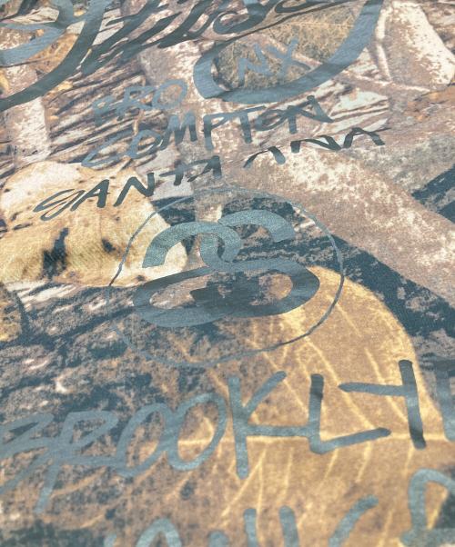 stussy（ステューシー）stussy (ステューシー) リアルツリーカモコーチジャケット ブラウン サイズ:Mの古着・服飾アイテム