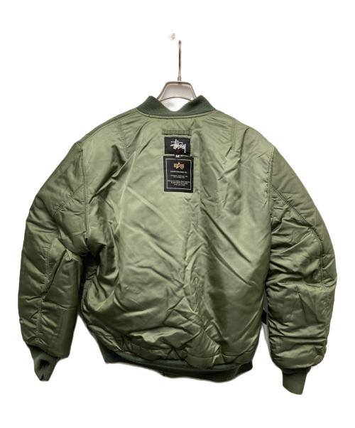 stussy（ステューシー）stussy (ステューシー) ALPHA (アルファ) FRAGMENT DESIGN (フラグメントデザイン) 25th Anniversary Ma-1 カーキ サイズ:Mの古着・服飾アイテム