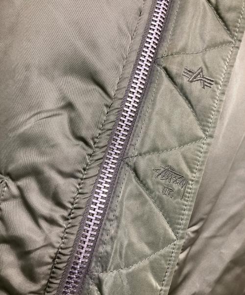 stussy（ステューシー）stussy (ステューシー) ALPHA (アルファ) FRAGMENT DESIGN (フラグメントデザイン) 25th Anniversary Ma-1 カーキ サイズ:Mの古着・服飾アイテム