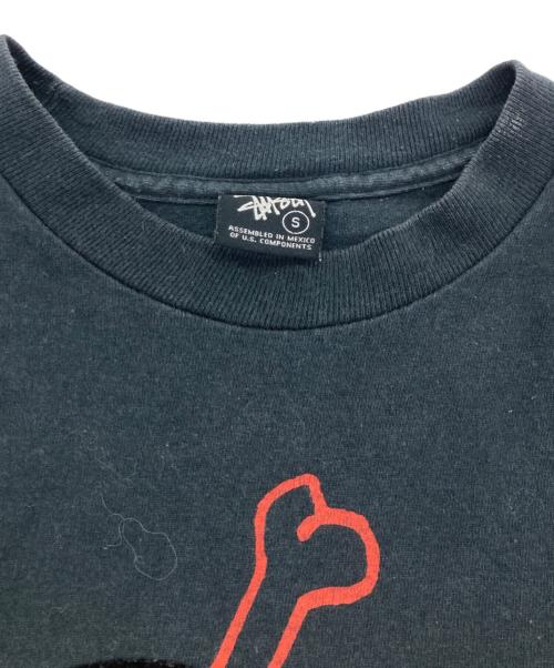 stussy（ステューシー）stussy (ステューシー) フロッキースカルプリントTシャツ ブラック サイズ:Sの古着・服飾アイテム