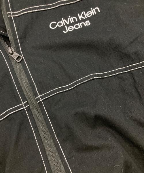 Calvin Klein Jeans（カルバンクラインジーンズ）Calvin Klein Jeans (カルバンクラインジーンズ) リプストップロゴジップアップブルゾン ブラック サイズ:Sの古着・服飾アイテム