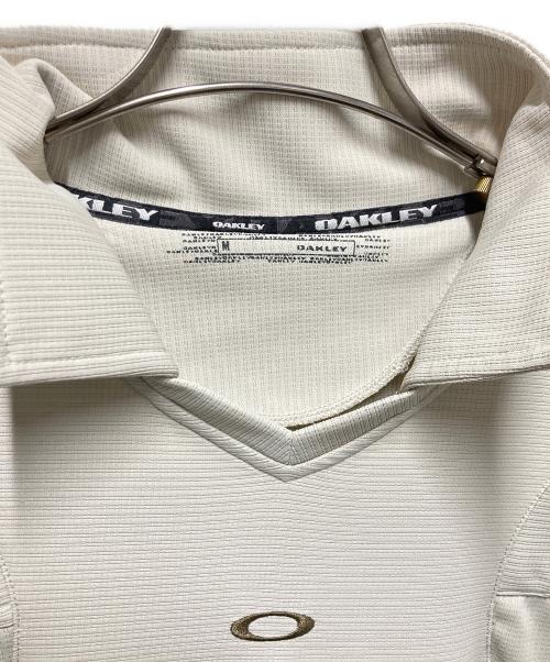OAKLEY（オークリー）OAKLEY (オークリー) フロントロゴスキッパーカットソー ベージュ サイズ:Mの古着・服飾アイテム