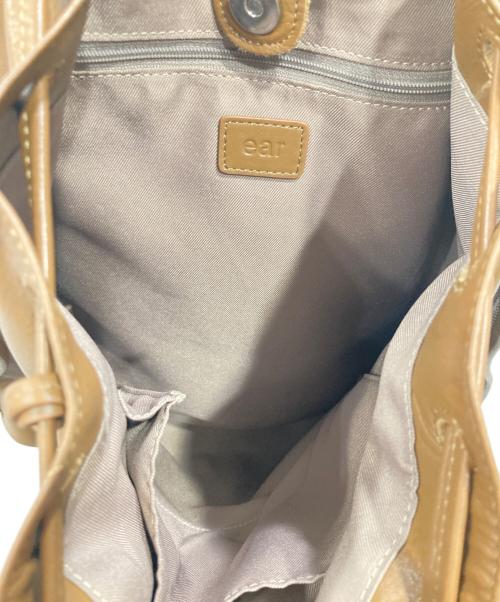 ear PAPILLONNER（イアパピヨネ）ear PAPILLONNER (イアパピヨネ) ロングタッセル巾着トートバッグの古着・服飾アイテム