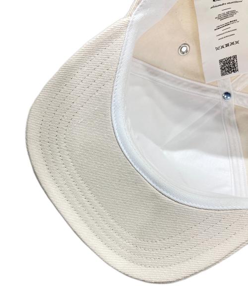AMI Alexandre Mattiussi（アミアレクサンドルマテュッシ）AMI Alexandre Mattiussi (アミアレクサンドルマテュッシ) パッチ トラッカーキャップ アイボリー サイズ:-の古着・服飾アイテム