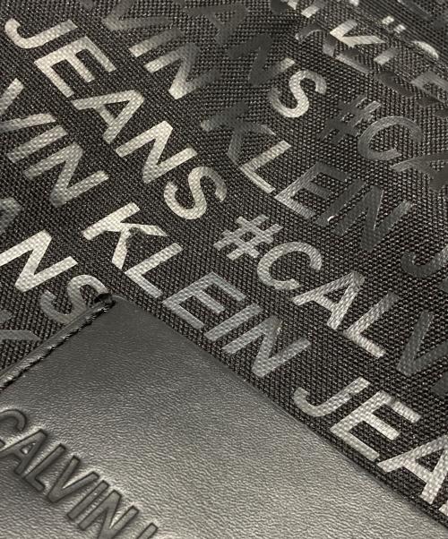 Calvin Klein Jeans（カルバンクラインジーンズ）Calvin Klein Jeans (カルバンクラインジーンズ) 総柄ロゴリュック ブラック サイズ:-の古着・服飾アイテム