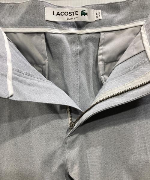 LACOSTE（ラコステ）LACOSTE (ラコステ) オックスフォードセンタークリーススラックス ライトグレー サイズ:34の古着・服飾アイテム