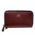 COACH（コーチ）の古着「長財布」｜メタリックレッド