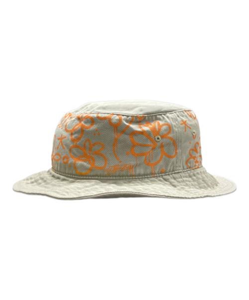 stussy（ステューシー）stussy (ステューシー) ロゴプリント バケットハット カーキ×オレンジ サイズ:Lの古着・服飾アイテム