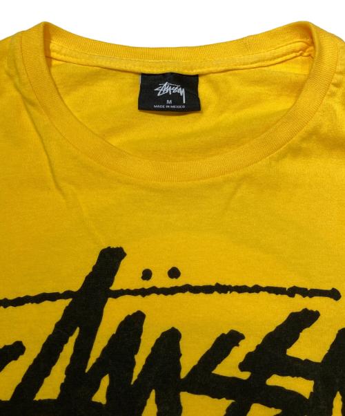stussy（ステューシー）stussy (ステューシー) WORLD TOUR TEE イエロー サイズ:Mの古着・服飾アイテム