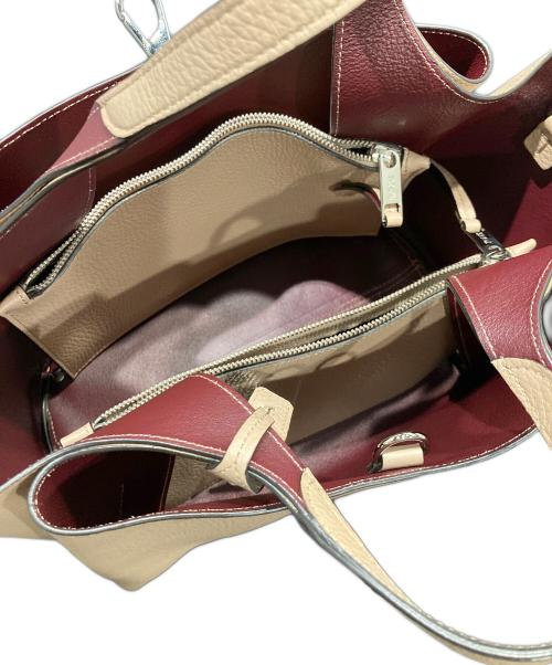 TOD'S（トッズ）TOD'S (トッズ) Tタイムレス 2WAY ハンドバッグ ベージュ×バーガンディの古着・服飾アイテム