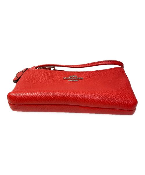 COACH（コーチ）COACH (コーチ) ダブルジップハンドポーチ オレンジの古着・服飾アイテム