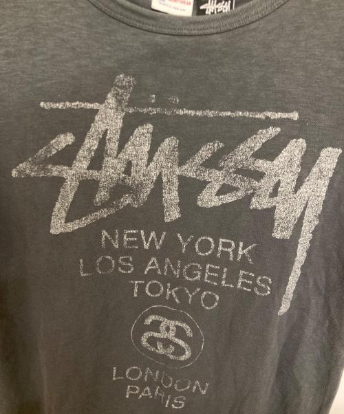 Champion（チャンピオン）Champion (チャンピオン) stussy (ステューシー) プリントTシャツ グレー サイズ:Sの古着・服飾アイテム