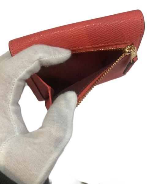 COACH（コーチ）COACH (コーチ) 2つ折り財布 オレンジの古着・服飾アイテム