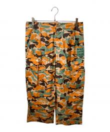 Stockholm Surfboard Club（ストックホルム サーフボード クラブ）の古着「Printed Cargo Trousers」｜オレンジ