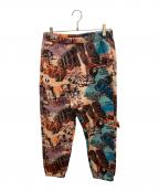 Aape BY A BATHING APEエーエイプ バイ アベイシングエイプ）の古着「Moonface logo graffiti print jogger pants / グラフィックプリントスウェットパンツ」｜ブラウン