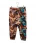 Aape BY A BATHING APE（エーエイプ バイ アベイシングエイプ）の古着「Moonface logo graffiti print jogger pants / グラフィックプリントスウェットパンツ」｜ブラウン
