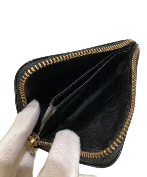 COMME des GARCONS（コムデギャルソン）COMME des GARCONS (コムデギャルソン) ドットエンボス L字型財布 ブラックの古着・服飾アイテム