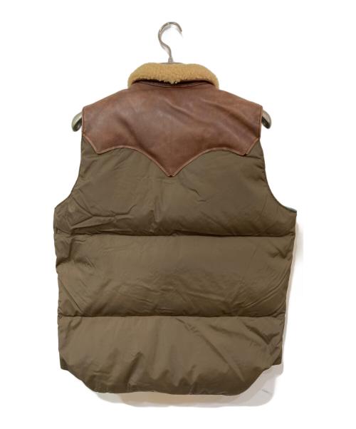 Rocky Mountain FeatherBed（ロッキーマウンテンフェザーベッド）Rocky Mountain FeatherBed (ロッキーマウンテンフェザーベッド) レザー切替ダウンベスト ブラウン×スカイブルー サイズ:不明の古着・服飾アイテム