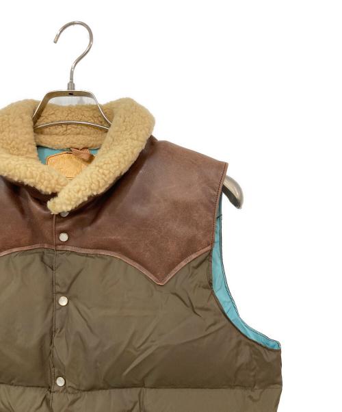 Rocky Mountain FeatherBed（ロッキーマウンテンフェザーベッド）Rocky Mountain FeatherBed (ロッキーマウンテンフェザーベッド) レザー切替ダウンベスト ブラウン×スカイブルー サイズ:不明の古着・服飾アイテム