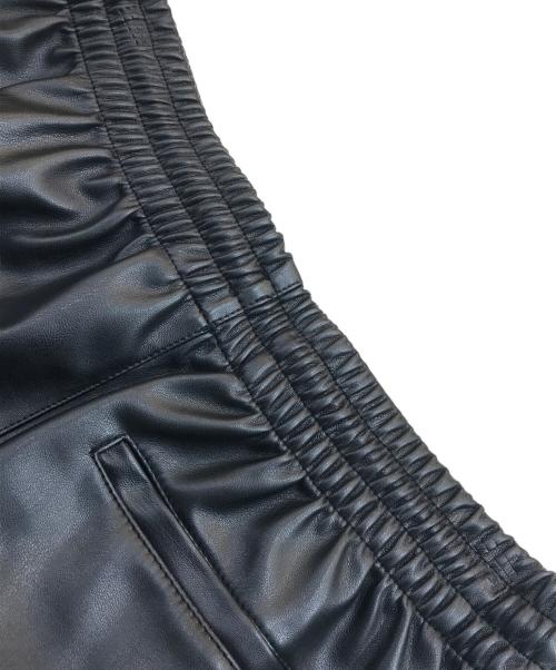 adidas（アディダス）adidas (アディダス) フェイクレザー アディカラー スリーストライプス ファイヤーバード トラックスーツパンツ ブラック サイズ:Lの古着・服飾アイテム