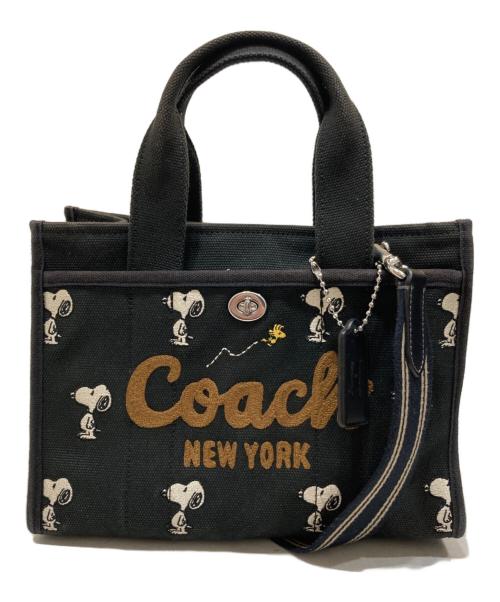 COACH（コーチ）COACH (コーチ) PEANUTS (ピーナッツ) カーゴ トート バッグ 26・スヌーピー プリント ブラックの古着・服飾アイテム