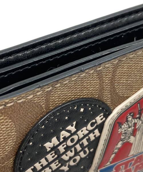 COACH（コーチ）COACH (コーチ) スターウォーズ・シグネチャー2つ折り財布 ベージュの古着・服飾アイテム