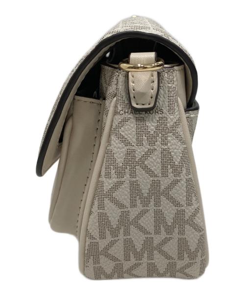 MICHAEL KORS（マイケルコース）MICHAEL KORS (マイケルコース) JET SET TRAVEL フラップ クロスボディ ウィズ テックアタッチ アイボリーの古着・服飾アイテム