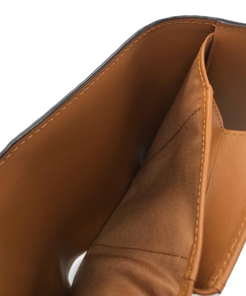 MCM（エムシーエム）MCM (エムシーエム) 3つ折り財布の古着・服飾アイテム