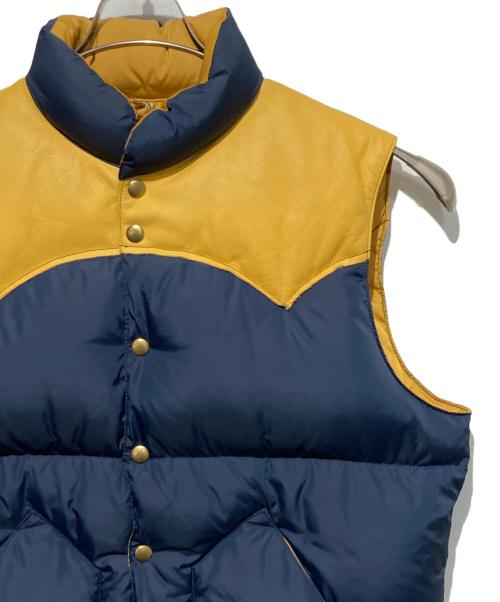 RockyMountainFeatherBed（ロッキーマウンテンフェザーベッド）RockyMountainFeatherBed (ロッキーマウンテンフェザーベッド) 50th ANNIVERSARY Down Vest ネイビー サイズ:42の古着・服飾アイテム