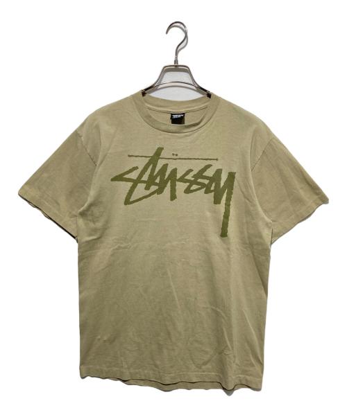 stussy（ステューシー）stussy (ステューシー) BEACH ROOTS プリントTシャツ カーキ サイズ:Lの古着・服飾アイテム