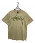 stussy（ステューシー）の古着「BEACH ROOTS プリントTシャツ」｜カーキ