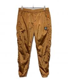 STONE ISLAND（ストーンアイランド）の古着「NYLON METAL TRACK PANTS」｜ブラウン