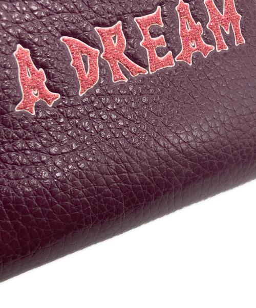 COACH（コーチ）COACH (コーチ) DISNEY (ディズニー) ラウンドファスナー財布 パープルの古着・服飾アイテム